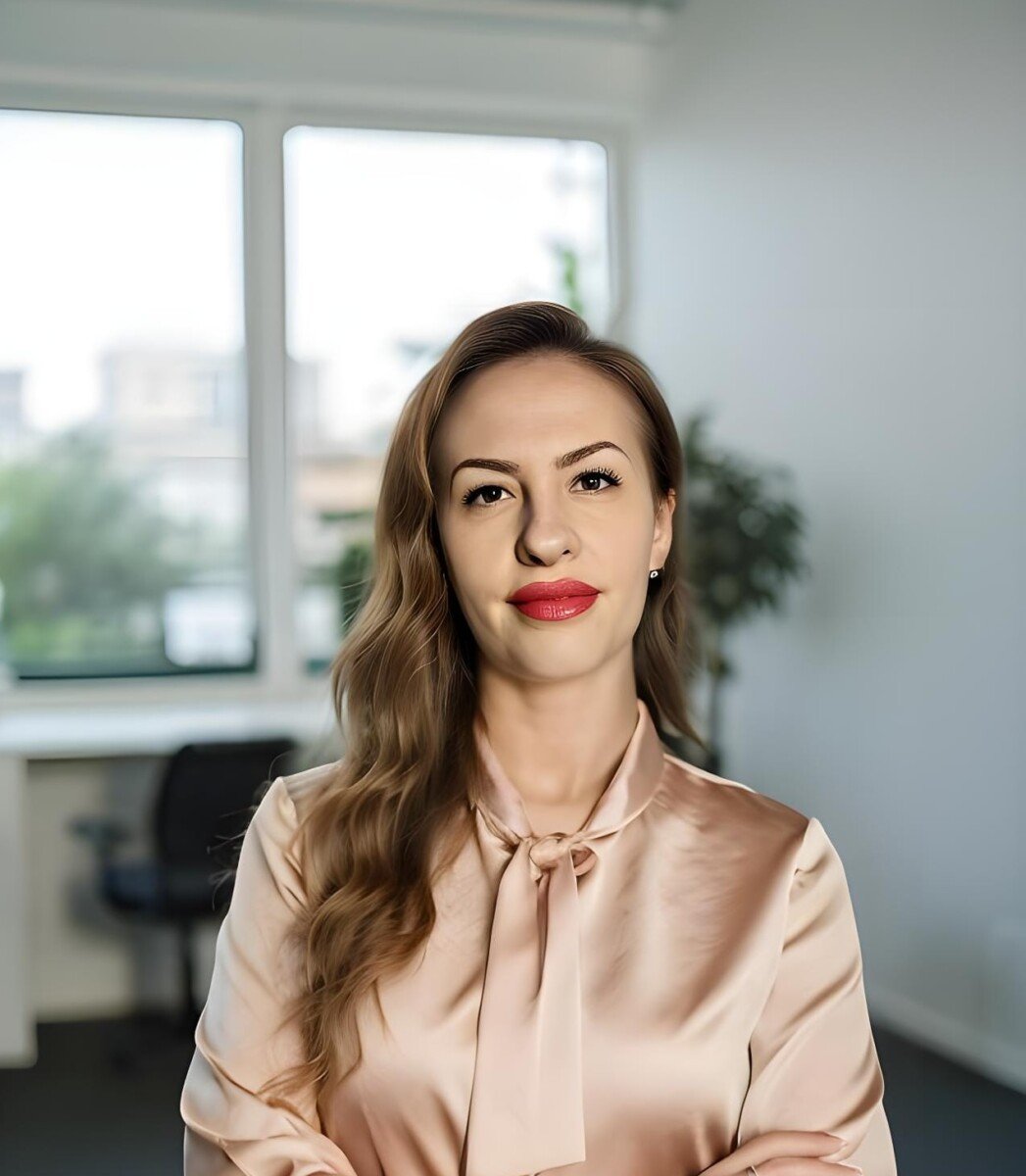 Portrait of Angelina, founder of Better Match Studio, smiling in office setting